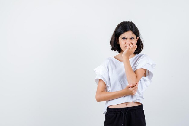 Expressive young girl posing in the studio