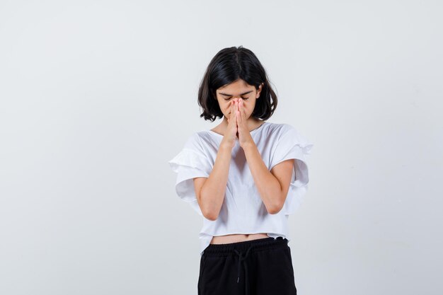 Expressive young girl posing in the studio