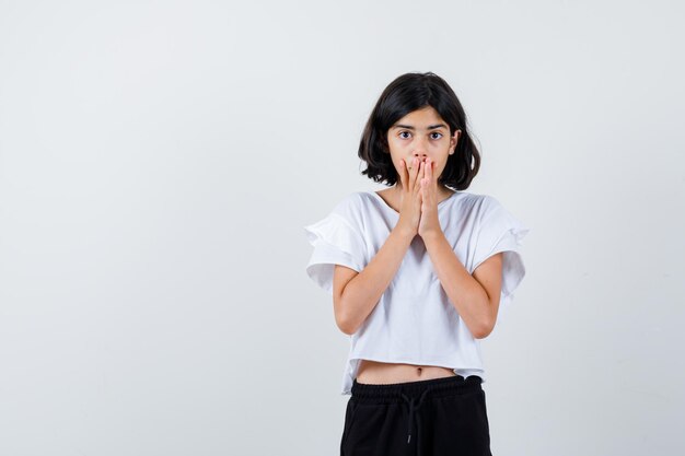 Expressive young girl posing in the studio