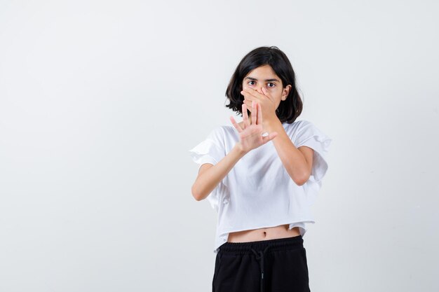 Expressive young girl posing in the studio