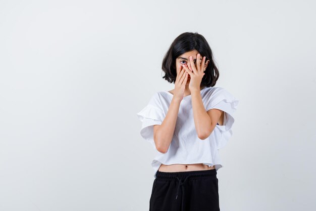 Expressive young girl posing in the studio