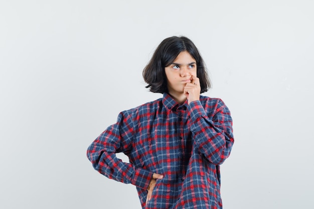 Expressive young girl posing in the studio