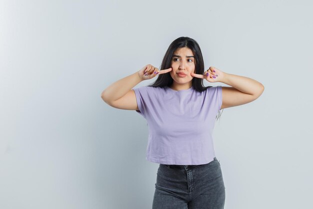 Expressive young girl posing in the studio