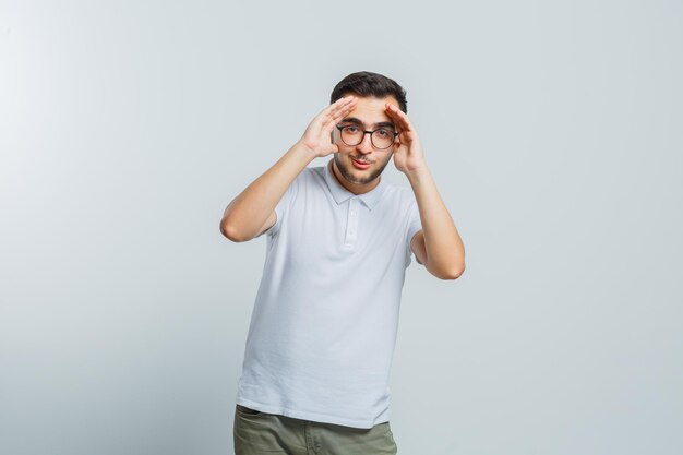 Expressive young guy posing in the studio