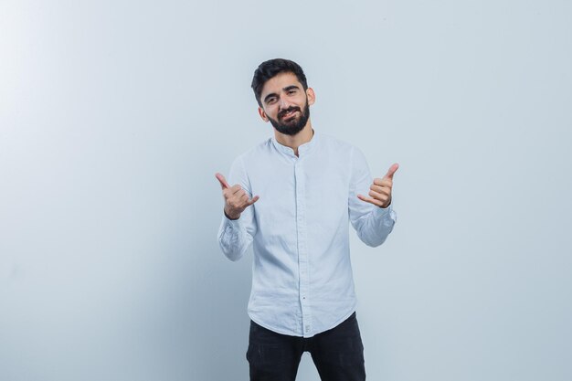 Expressive young guy posing in the studio