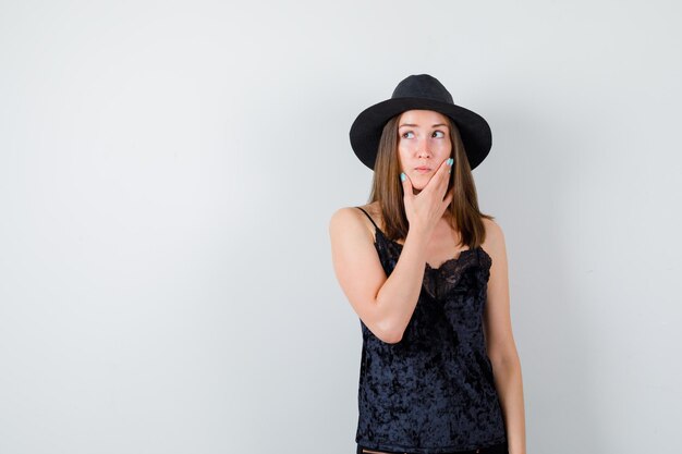 Expressive young lady posing in the studio