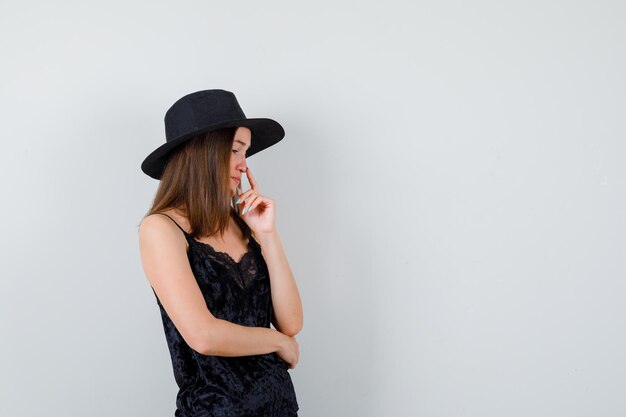 Expressive young lady posing in the studio