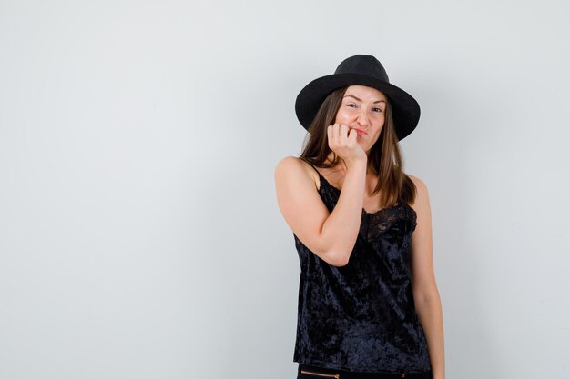 Expressive young lady posing in the studio