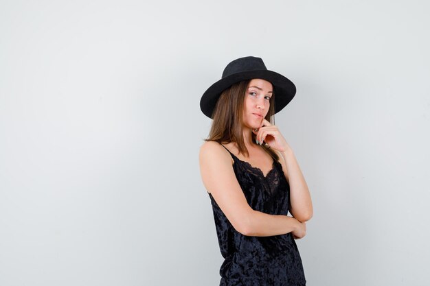 Expressive young lady posing in the studio