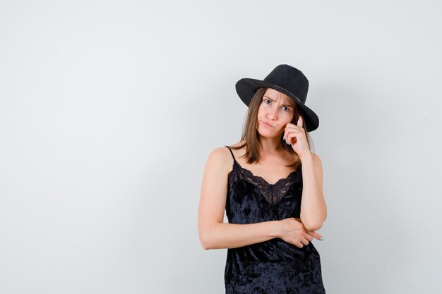 Expressive young lady posing in the studio