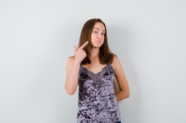 Expressive young lady posing in the studio