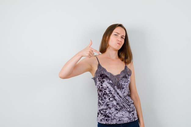 Expressive young lady posing in the studio