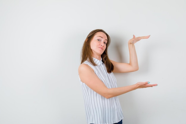 Expressive young lady posing in the studio