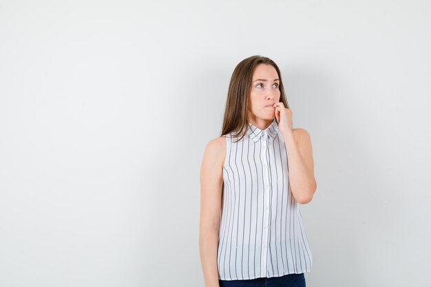 Expressive young lady posing in the studio