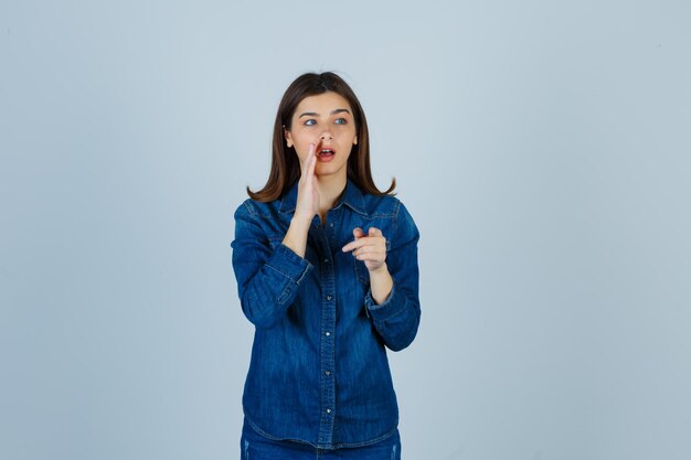 Expressive young lady posing in the studio