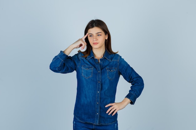 Expressive young lady posing in the studio