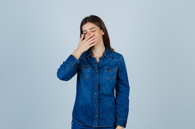 Expressive young lady posing in the studio