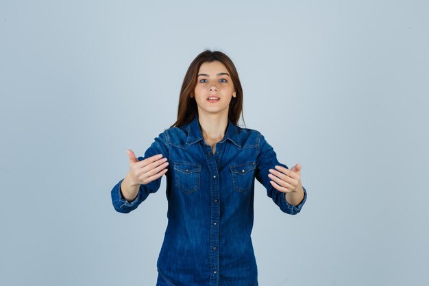 Expressive young lady posing in the studio