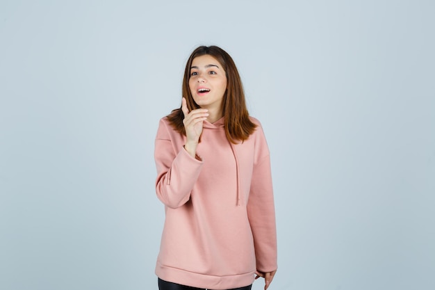 Expressive young lady posing in the studio