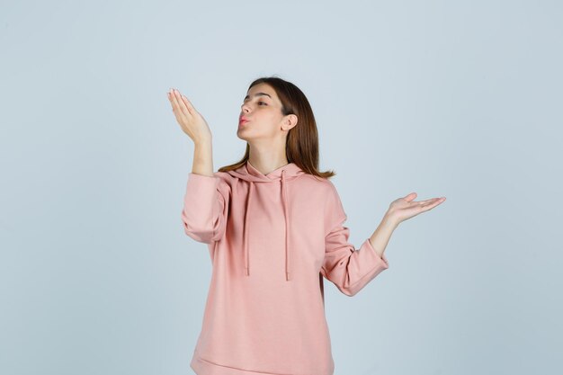 Expressive young lady posing in the studio