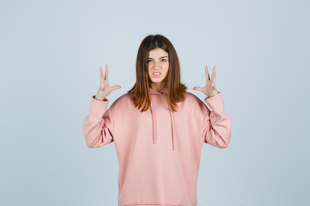 Expressive young lady posing in the studio