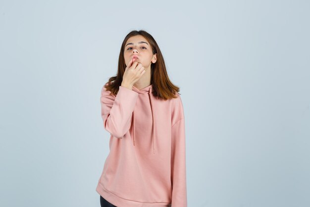 Expressive young lady posing in the studio