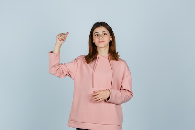 Expressive young lady posing in the studio