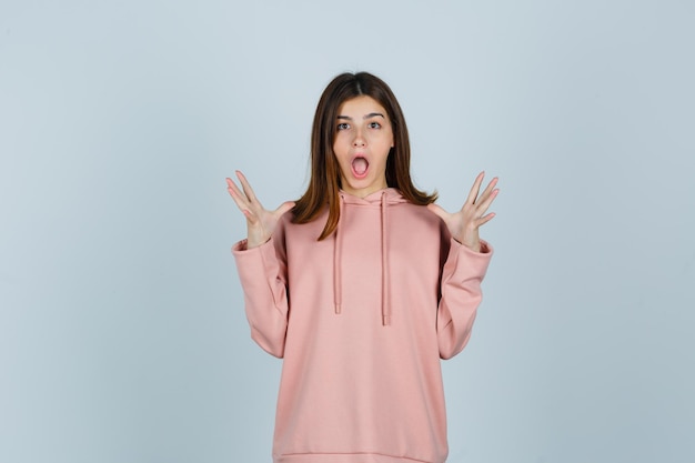 Expressive young lady posing in the studio