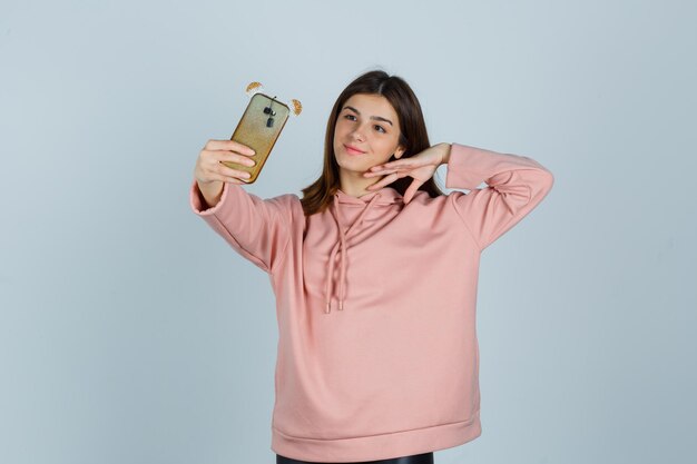 Expressive young lady posing in the studio