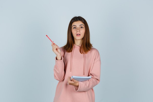 Expressive young lady posing in the studio