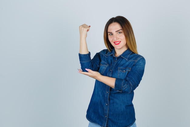 Expressive young lady posing in the studio