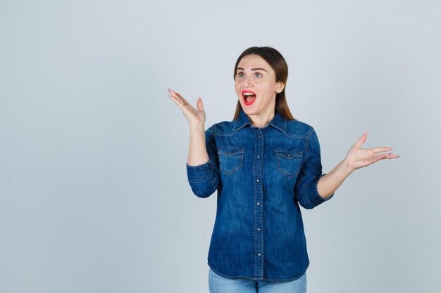 Expressive young lady posing in the studio