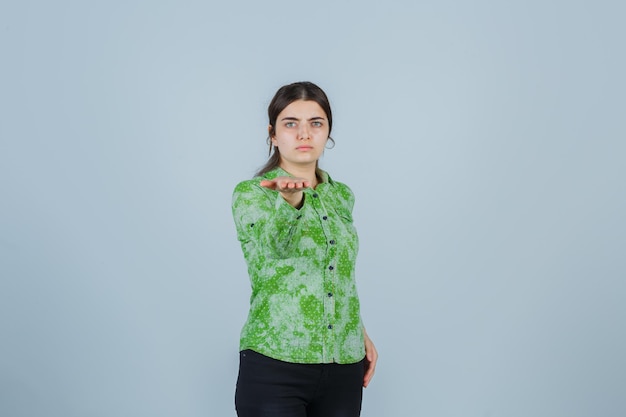 Expressive young lady posing in the studio