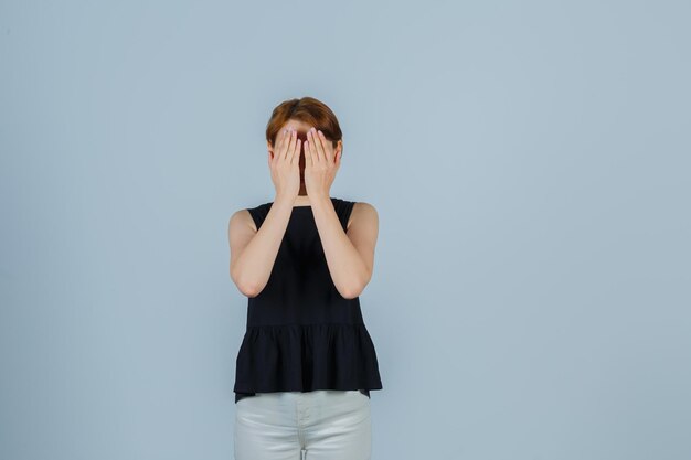 Expressive young lady posing in the studio