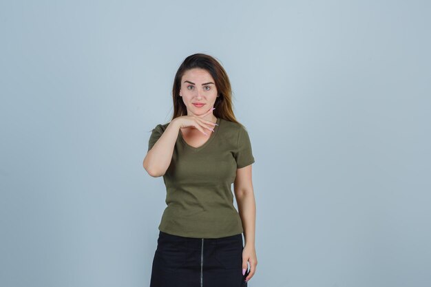 Expressive young lady posing in the studio