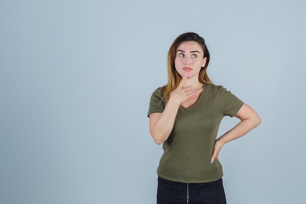 Expressive young lady posing in the studio