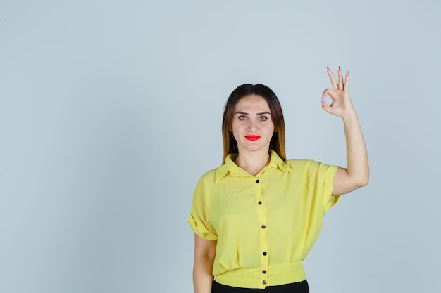 Expressive young lady posing in the studio