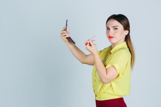 Expressive young lady posing in the studio