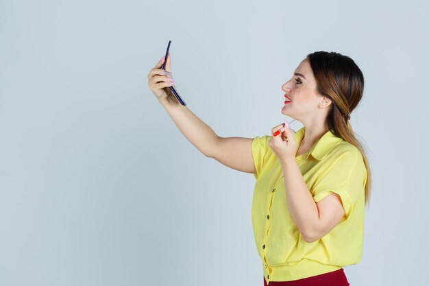 Expressive young lady posing in the studio