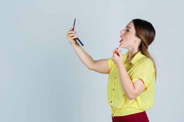 Expressive young lady posing in the studio