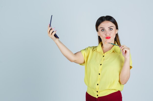 Expressive young lady posing in the studio