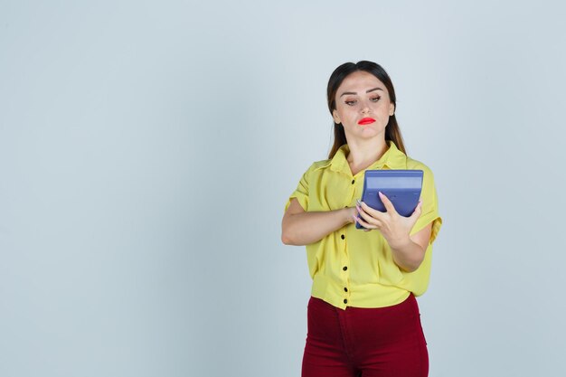 Expressive young lady posing in the studio