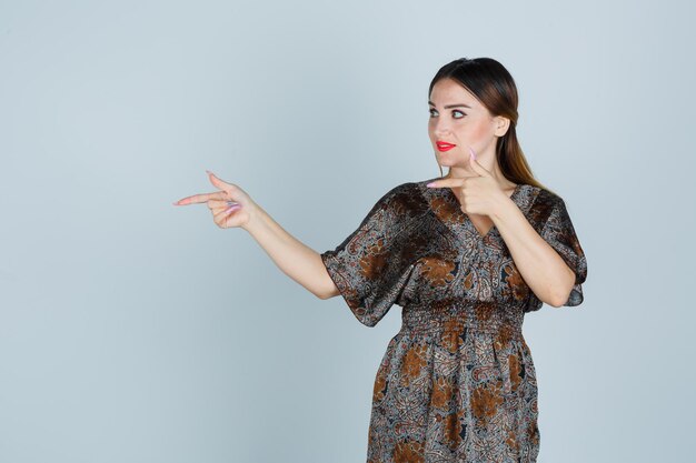 Expressive young lady posing in the studio