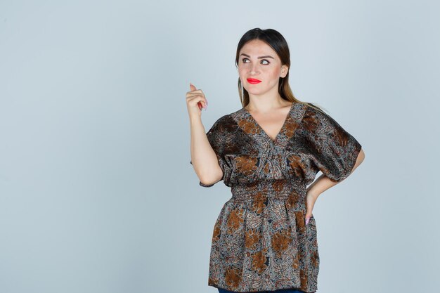 Expressive young lady posing in the studio