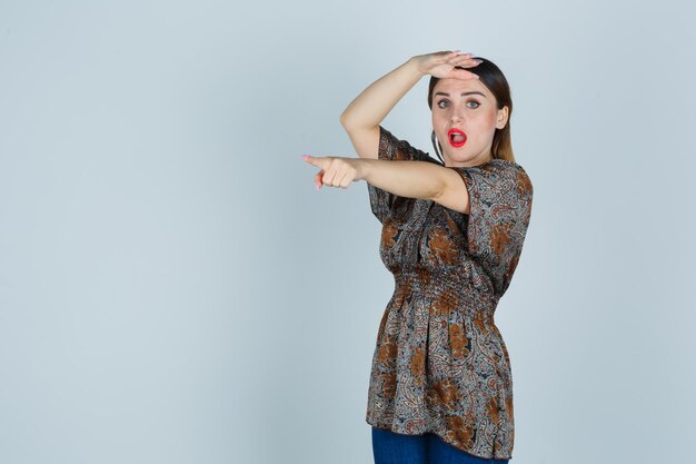 Expressive young lady posing in the studio