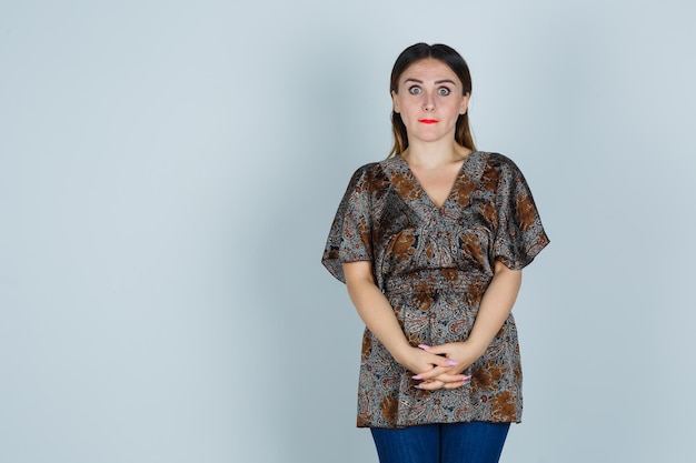 Expressive young lady posing in the studio