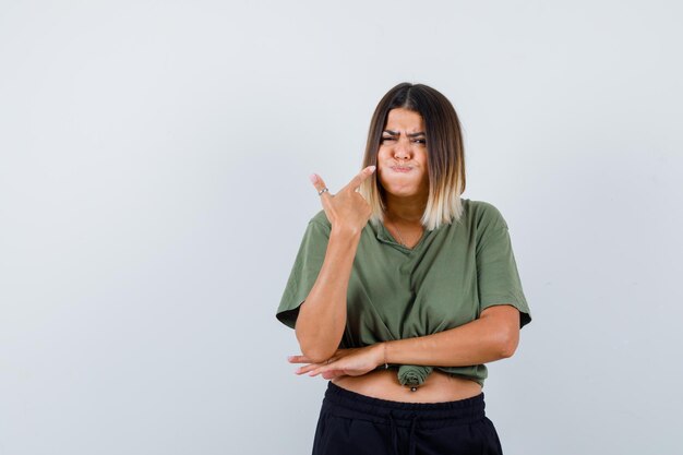 Expressive young lady posing in the studio