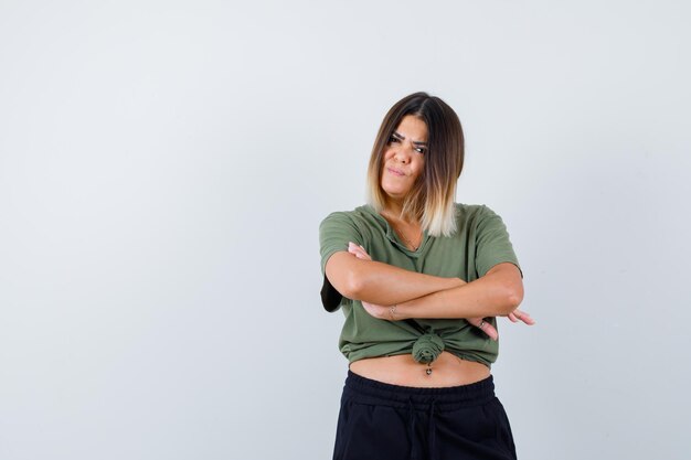 Expressive young lady posing in the studio