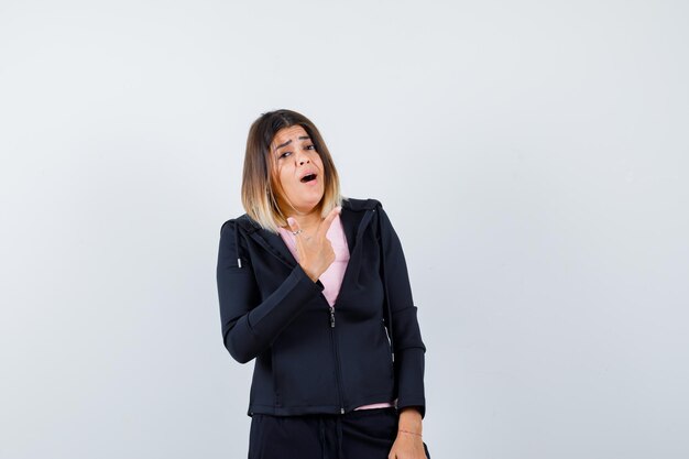 Expressive young lady posing in the studio