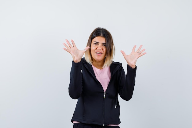 Expressive young lady posing in the studio